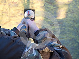 A man aims an air rifl