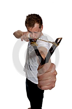 A man aims a slingshot