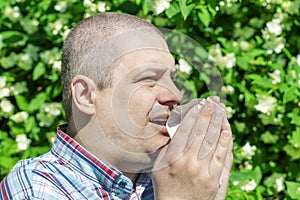 Man with allergy sneezes