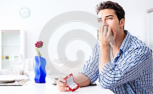 Man alone preparing for romantic date with his sweetheart