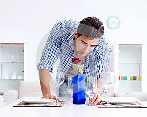 Man alone preparing for romantic date with his sweetheart