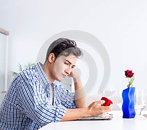 Man alone preparing for romantic date with his sweetheart