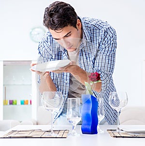 Man alone preparing for romantic date with his sweetheart