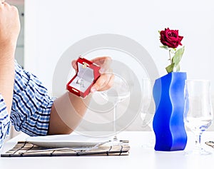 Man alone preparing for romantic date with his sweetheart