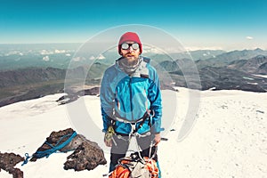 Man alpinist climbing in mountains