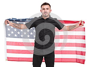 Man with American flag in his hands behind his back isolated on white background