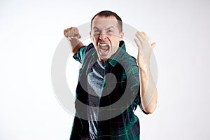 Man in anger shouts, domestic violence, irritation, an angry expression on his face