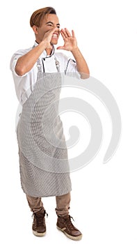 Man is angry and screams. Black cook wears apron. Isolated on white background..