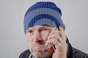 A man is angry while talking on his cell phone