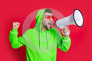 man announcer with loudspeaker in studio. man announcer with loudspeaker shouting.