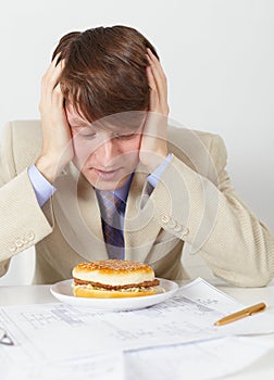 Man in an anticipation of eating of hamburger photo
