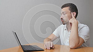 Man in anticipation about notebook