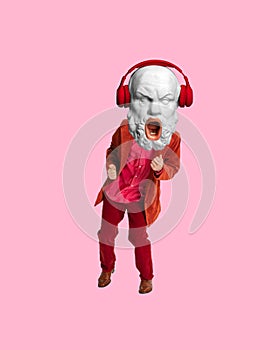 Man with antique statue bust, in red suit listening to music in headphones and dancing. Contemporary art collage.