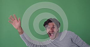 Man appearing waving hand and disappearing on green screen