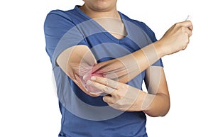 Man apply painkillers to elbow , elbow muscle pain from inflammation