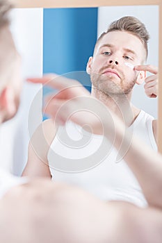 Man applying face cream