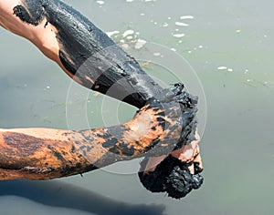 Man applying healing clay