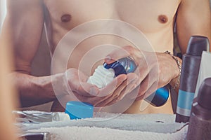 Man applying shaving foam on his hand