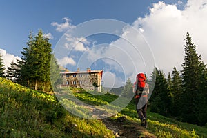 Man aproaching mountain hut