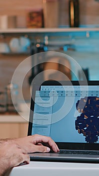 Man architect with wireless headset using laptop