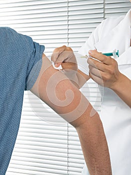 Man arm vaccine injection with a syringe at hospital vial covid-19 coronavirus vaccines ampoule