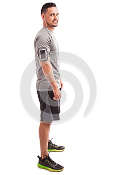 Man with an armband and earbuds