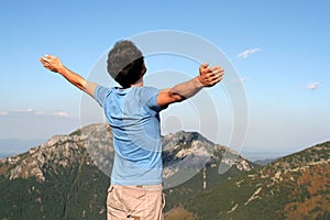 Man with arms outstretched photo