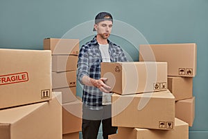 Man arranging boxes at warehouse