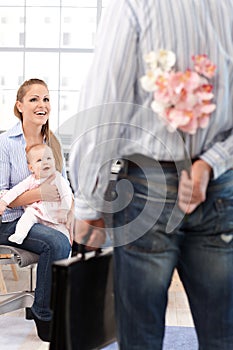 Man arriving home with flower