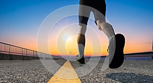 A man as athlete runner in high speed running action on the road