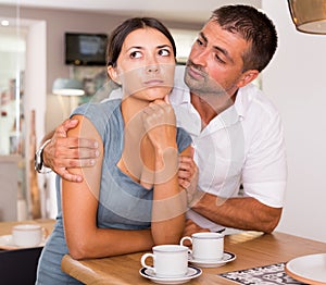 Man asking for forgiveness from girlfriend