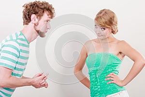 Man asking for forgivness. Conflicted couple.