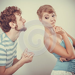 Man asking for forgivness. Conflicted couple