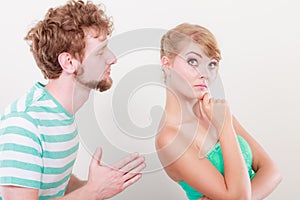 Man asking for forgivness. Conflicted couple. photo