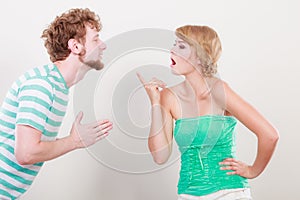 Man asking for forgivness. Conflicted couple. photo