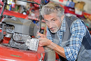 Man assemble brush cutter engine