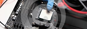 Man assembles components to build computer closeup