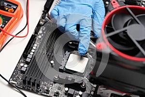 Man assembles components to build computer closeup