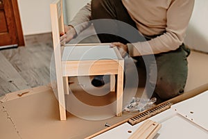 A man assembling new furniture bought for home