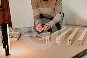 A man assembling new furniture bought for home