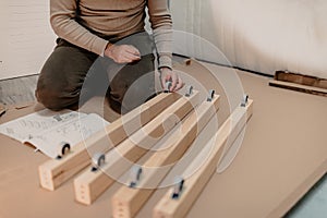 A man assembling new furniture bought for home