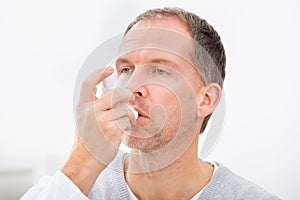 Man with asthma inhaler photo