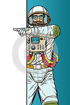 Man astronaut. Point to copy space poster