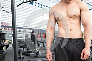 man athlete prepare for training in gym. bodybuilder male working out in fitness center. sport guy doing exercises in health club.