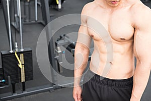 man athlete prepare for training in gym. bodybuilder male working out in fitness center. sport guy doing exercises in health club.