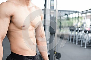 man athlete prepare for training in gym. bodybuilder male working out in fitness center. sport guy doing exercises in health club.