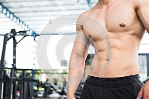 man athlete prepare for training in gym. bodybuilder male working out in fitness center. sport guy doing exercises in health club.