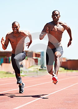 Man, athlete and running and competitive for race on track with practice for competition. Black people, together and