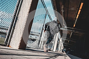 Man athlete running through urban view