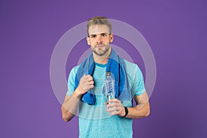 Man athletic hold water bottle. Handsome athlete drink water. Water balance. Sport for better life. Thirsty man. Athlete